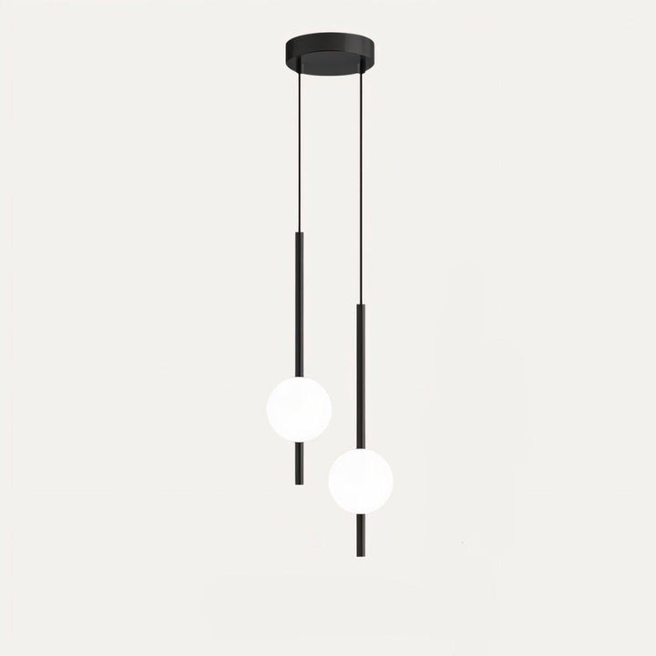 "Sleek glass ball Nordic pendant light with metal frame, LED bulb; available in black or brass, perfect for modern decor."