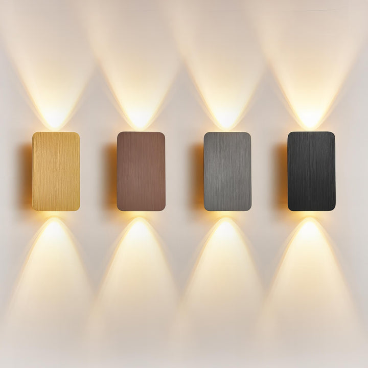"Sleek indoor LED wall lamp with a modern rectangular design, featuring smooth finishes and warm illumination for elegant dec