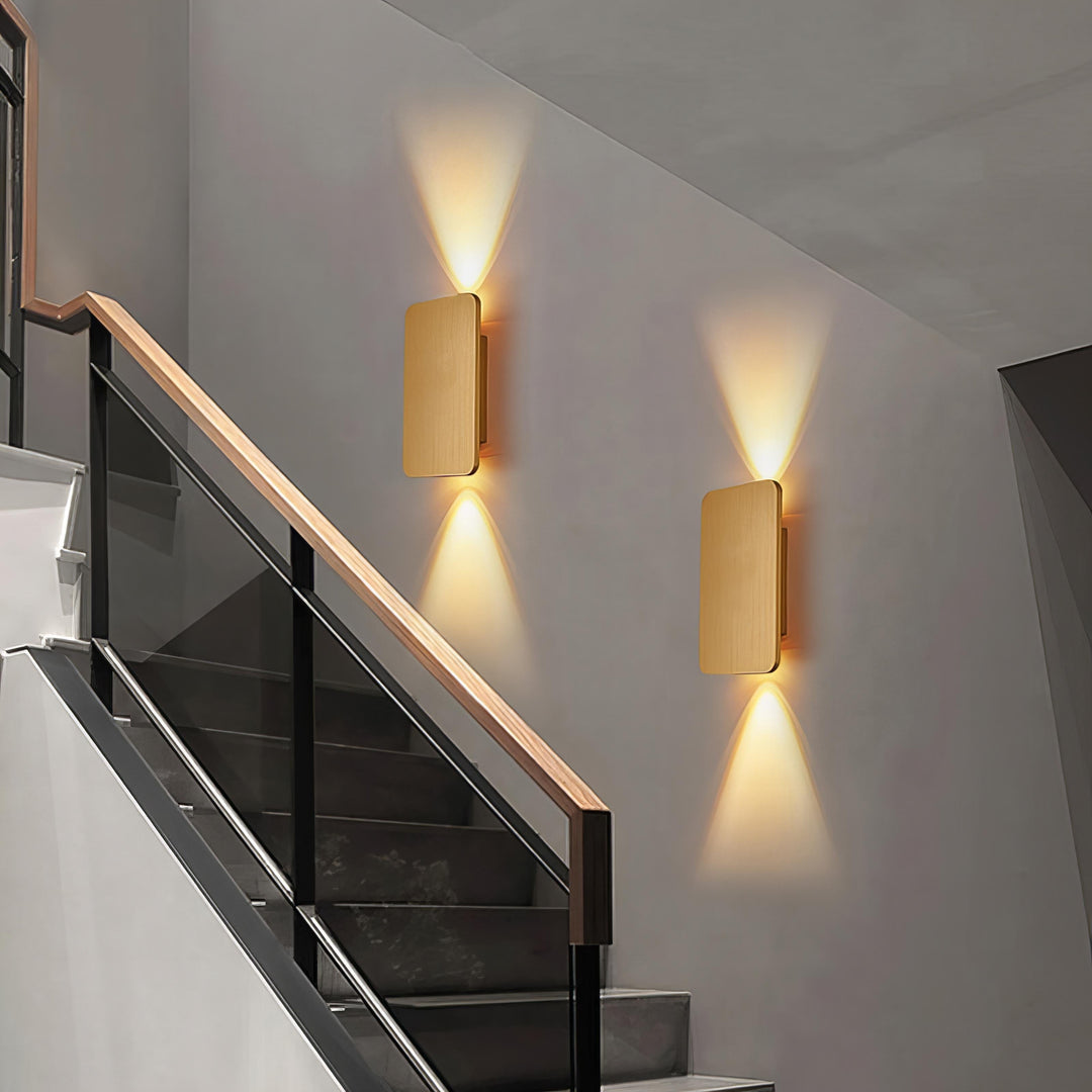 "Sleek indoor LED wall lamp with a modern rectangular design, featuring smooth finishes and warm illumination for elegant dec