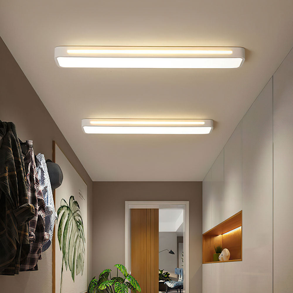 "Sleek minimalist linear LED ceiling light with iron and acrylic design, perfect for modern homes, available in three sizes."