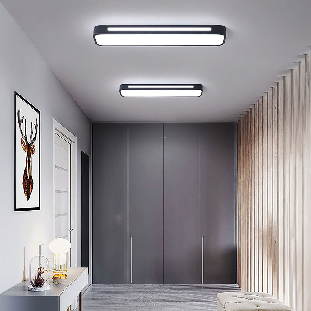 "Sleek minimalist linear LED ceiling light with iron and acrylic design, perfect for modern homes, available in three sizes."