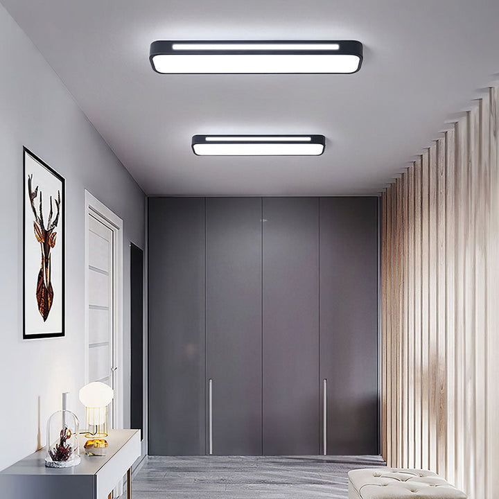"Sleek minimalist linear LED ceiling light with iron and acrylic design, perfect for modern homes, available in three sizes."