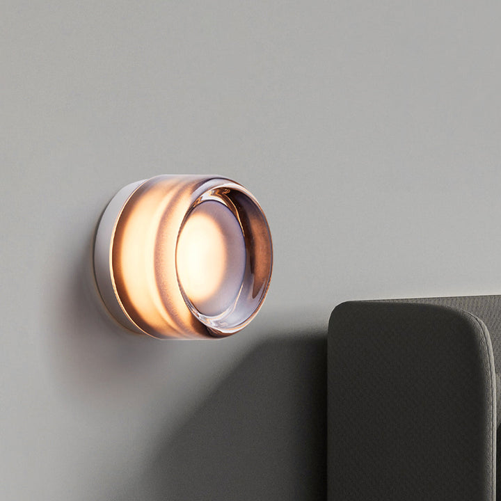 "Sleek wall mounted LED sconce light with acrylic and aluminum design, offering versatile decor enhancement for modern interi
