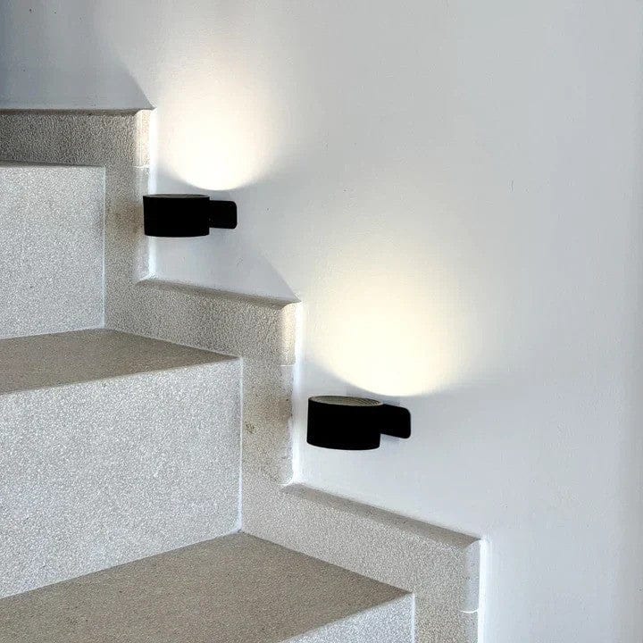 "Sleek wireless rechargeable wall light with magnetic mount and 360° rotation for modern home interiors."