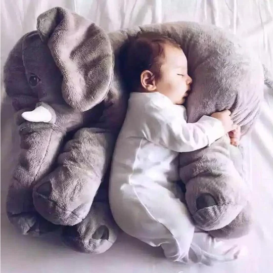"Soft baby elephant plush pillow, perfect for snuggling and play, in pastel colors for newborn comfort and nursery decor."