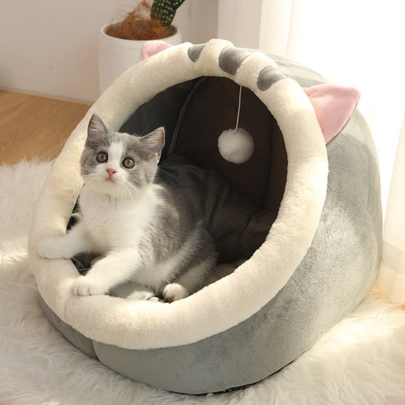 Soft Cat's Cozy Retreat PawCave pet bed, a warm feline hideaway for ultimate comfort. Perfect indoor cat house.