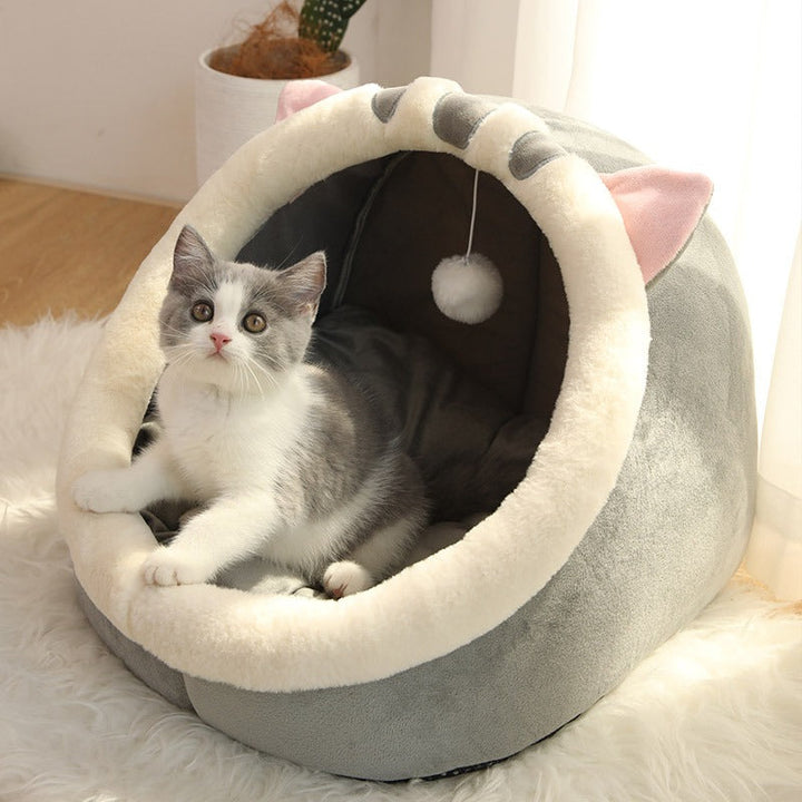 Soft Cat's Cozy Retreat PawCave pet bed, a warm feline hideaway for ultimate comfort. Perfect indoor cat house.