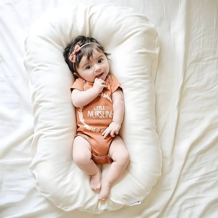 Ergonomic baby orthopedic pillow preventing flat head, supporting infant's head & neck with breathable design.