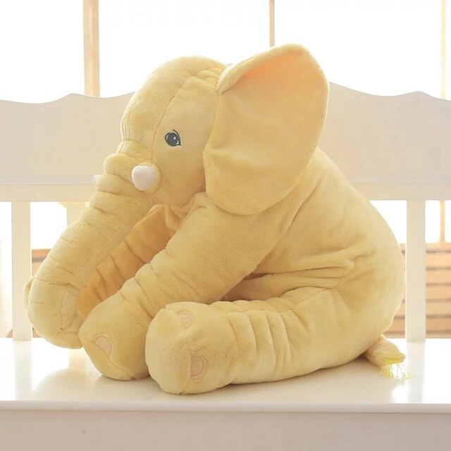 Plush elephant comfort pillow for kids, a soft huggable toy perfect for nursery decor and snuggling.