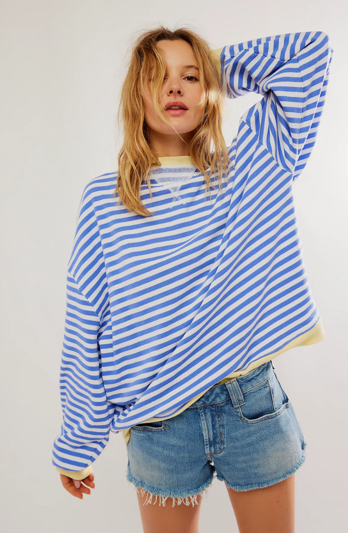 "Soft women's striped crewneck sweater, high-quality material, timeless design, versatile fashion for casual wear."