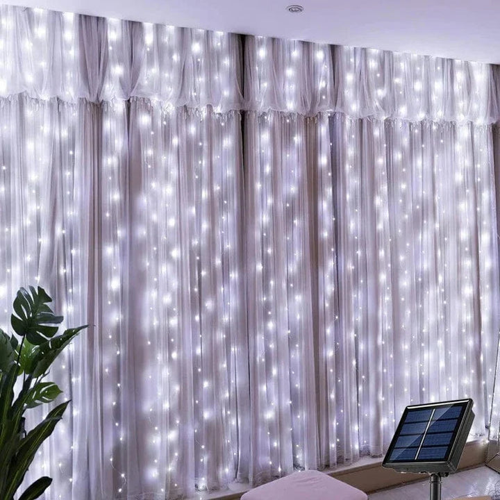 "Solar LED curtain light with copper wire, ideal for events, featuring warm white LEDs and solar power, outdoor use."