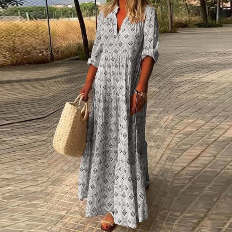 Elegant long women's summer maxi dress. Bohemian style, colorful print, great for beach, resort, or flowy everyday.