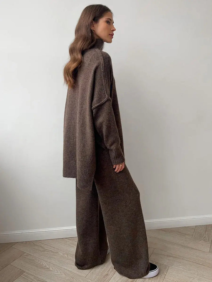 Full shot of a women's relaxed turtleneck lounge set, highlighting the wide-leg pants & cozy top.