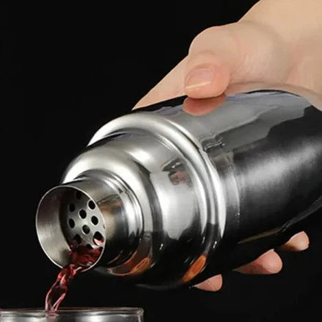 Sophisticated 10-piece stainless steel cocktail set with shaker, jigger, spoon, muddler, pourers, tongs, and storage stand.