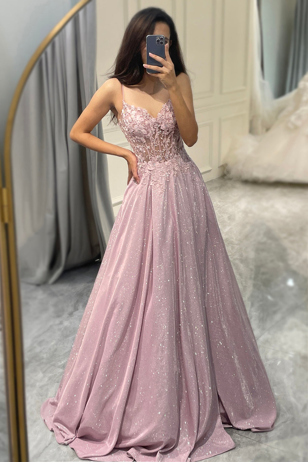 Flowing light pink women's maxi dress with elegant embellishments, ideal for formal parties or wedding guests.