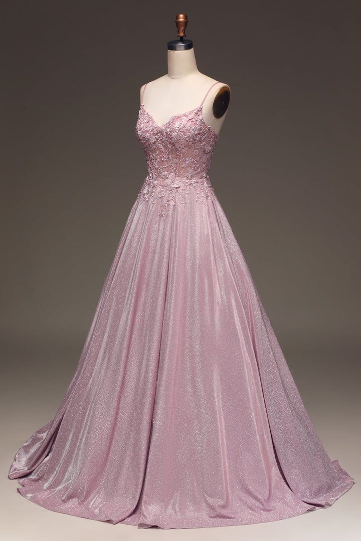 Women's elegant embellished light pink maxi dress, a gorgeous special occasion or formal wedding guest outfit.