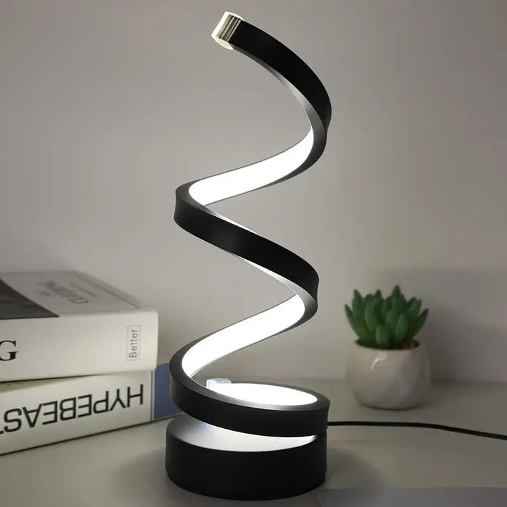 Contemporary spiral LED table lamp, black finish. Dimmable for ambient lighting & energy efficient home decor.
