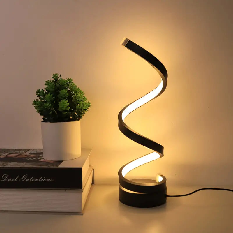 Modern black spiral LED desk lamp with dimmable ambient light. Perfect for office or bedroom decor.