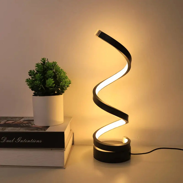 Modern black spiral LED desk lamp with dimmable ambient light. Perfect for office or bedroom decor.