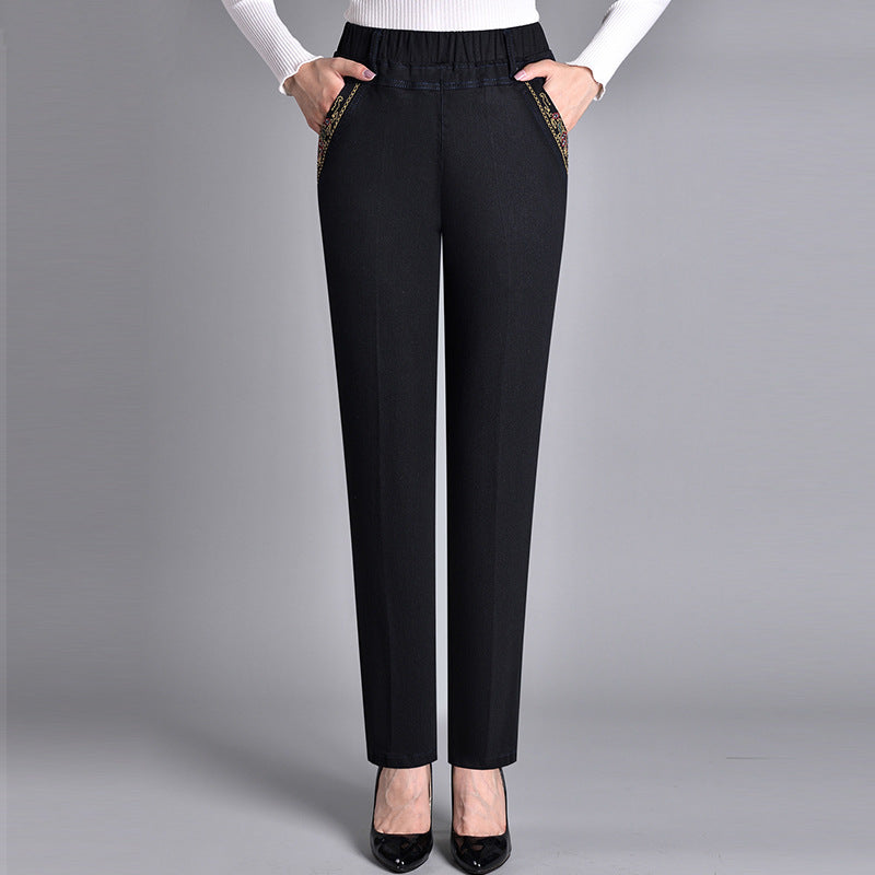Plus size women's comfortable stretch jeans with elastic waist, straight leg, and practical side pockets.