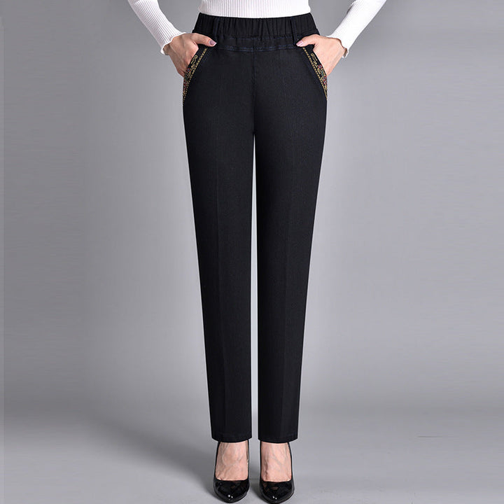 Plus size women's comfortable stretch jeans with elastic waist, straight leg, and practical side pockets.