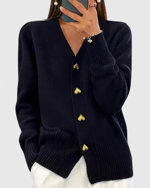 Elegant women's cardigan with heart buttons, perfect for a chic autumn layering look. Cozy long sleeve design.