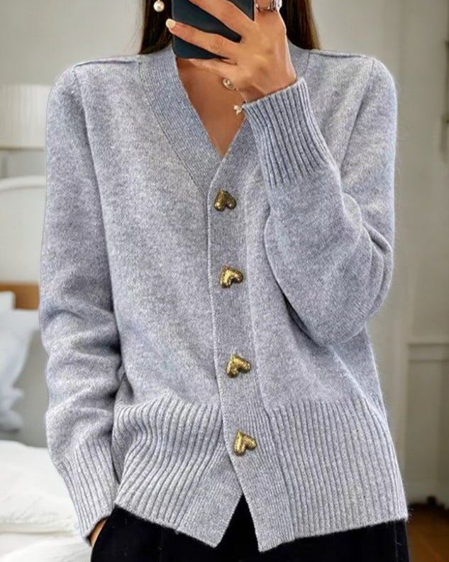 Women's romantic v-neck cardigan with unique heart buttons. Elegant & cozy long sleeve sweater for winter chic.