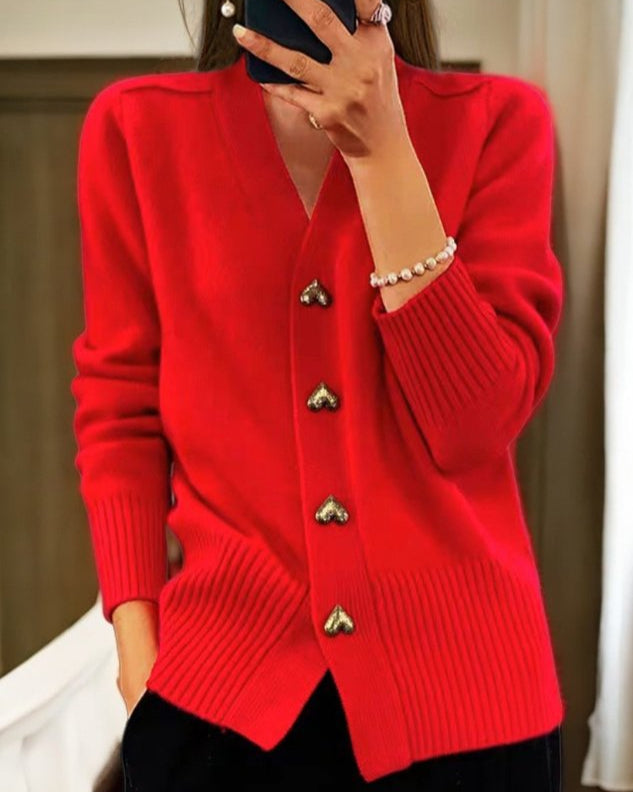 Elegant women's v-neck cardigan, featuring charming heart buttons. Soft long sleeve design, perfect for romantic style.