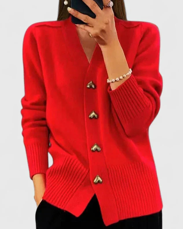 Comfortable & chic women's cardigan. Elegant long sleeve design with adorable heart buttons for versatile wear.