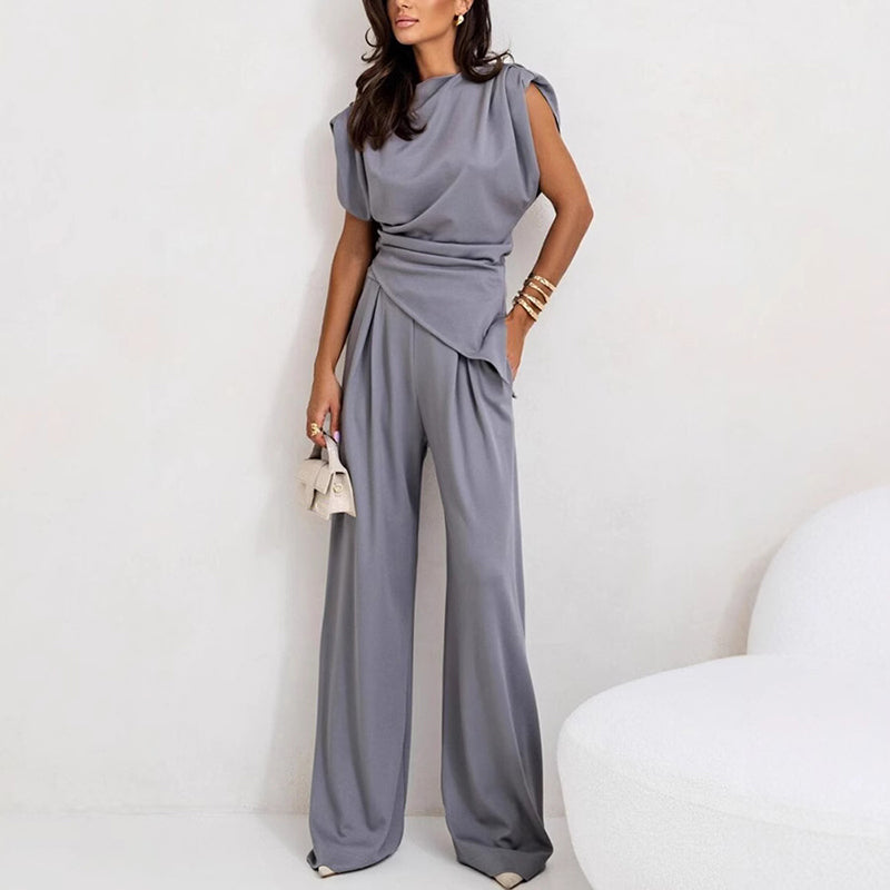 Fashionable women's matching outfit: draped top paired with comfortable wide-leg trousers for everyday elegance.