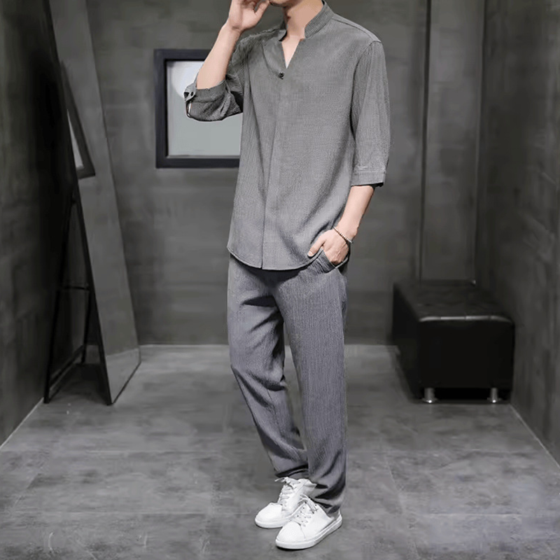 Stylish men's linen blend two-piece set. Relaxed fit V-neck shirt & drawstring pants for a cool summer look.
