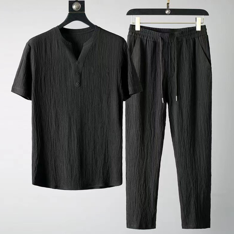 Soft linen blend men's relaxed fit two-piece set. Includes a V-neck shirt & drawstring pants for comfort.