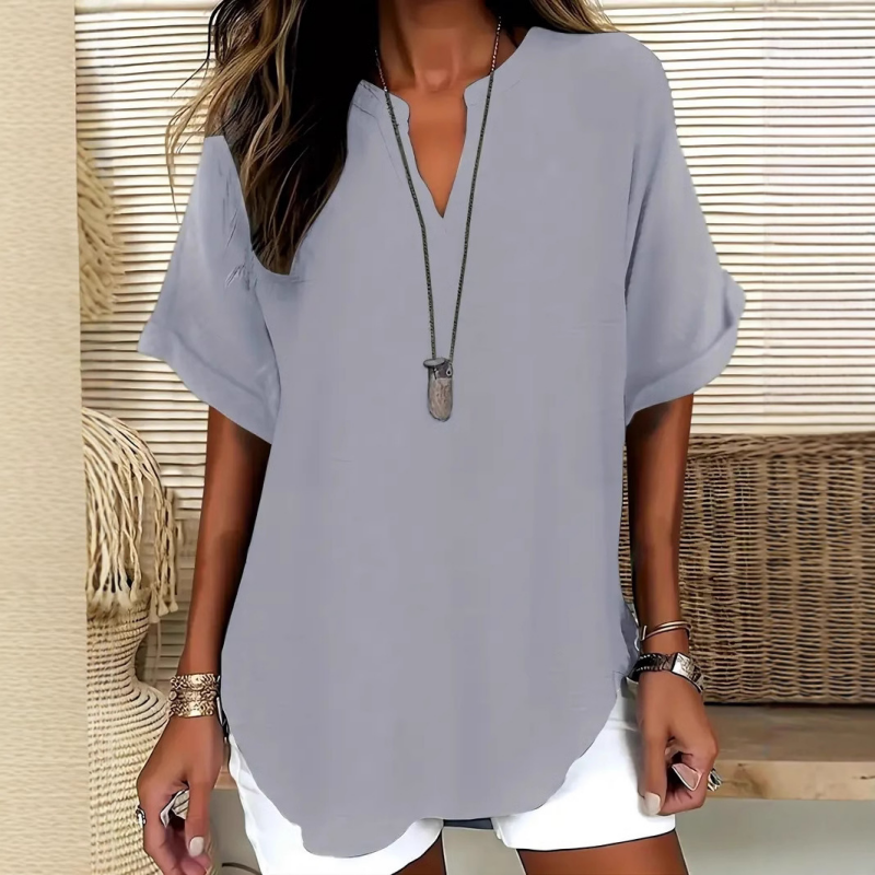 Relaxed fit women's mid sleeve V-neck blouse, a chic and comfortable top for everyday fashion.