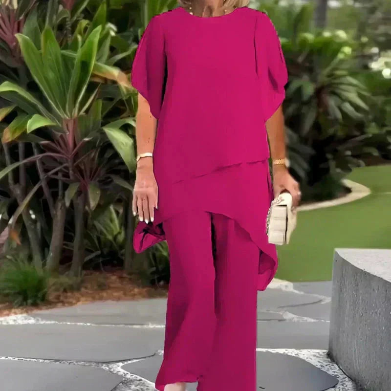 Elegant women's two-piece set, featuring chic wide-leg trousers & a sophisticated layered top. Fashion ensemble.