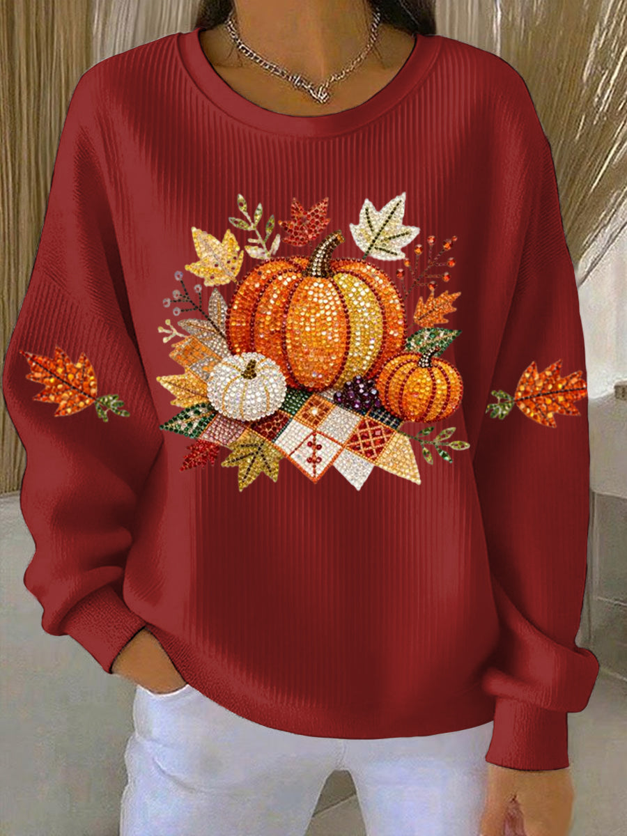 Woman styled in a relaxed fit pumpkin graphic sweatshirt, showcasing a comfy and stylish autumn casual top.