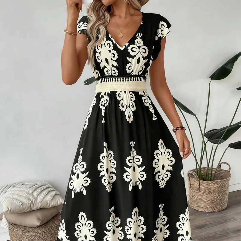 Back view of an elegant women's embroidered summer midi dress, showing flared hem detail.