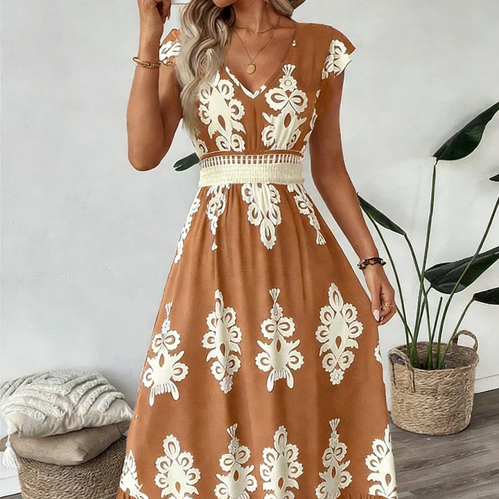 Detailed shot of the fabric and embroidery on a women's elegant summer midi dress.