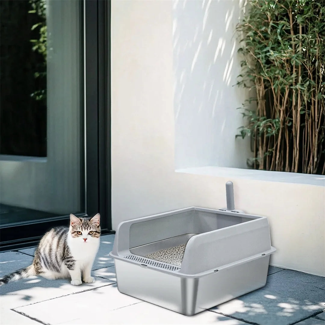 "Stainless steel cat litter box with easy front access and tall sides, ideal for hygienic pet spaces and easy maintenance."