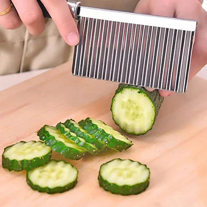 "Stainless steel crinkle cutter knife with a sleek blade, perfect for slicing vegetables and fruits with ergonomic handle."