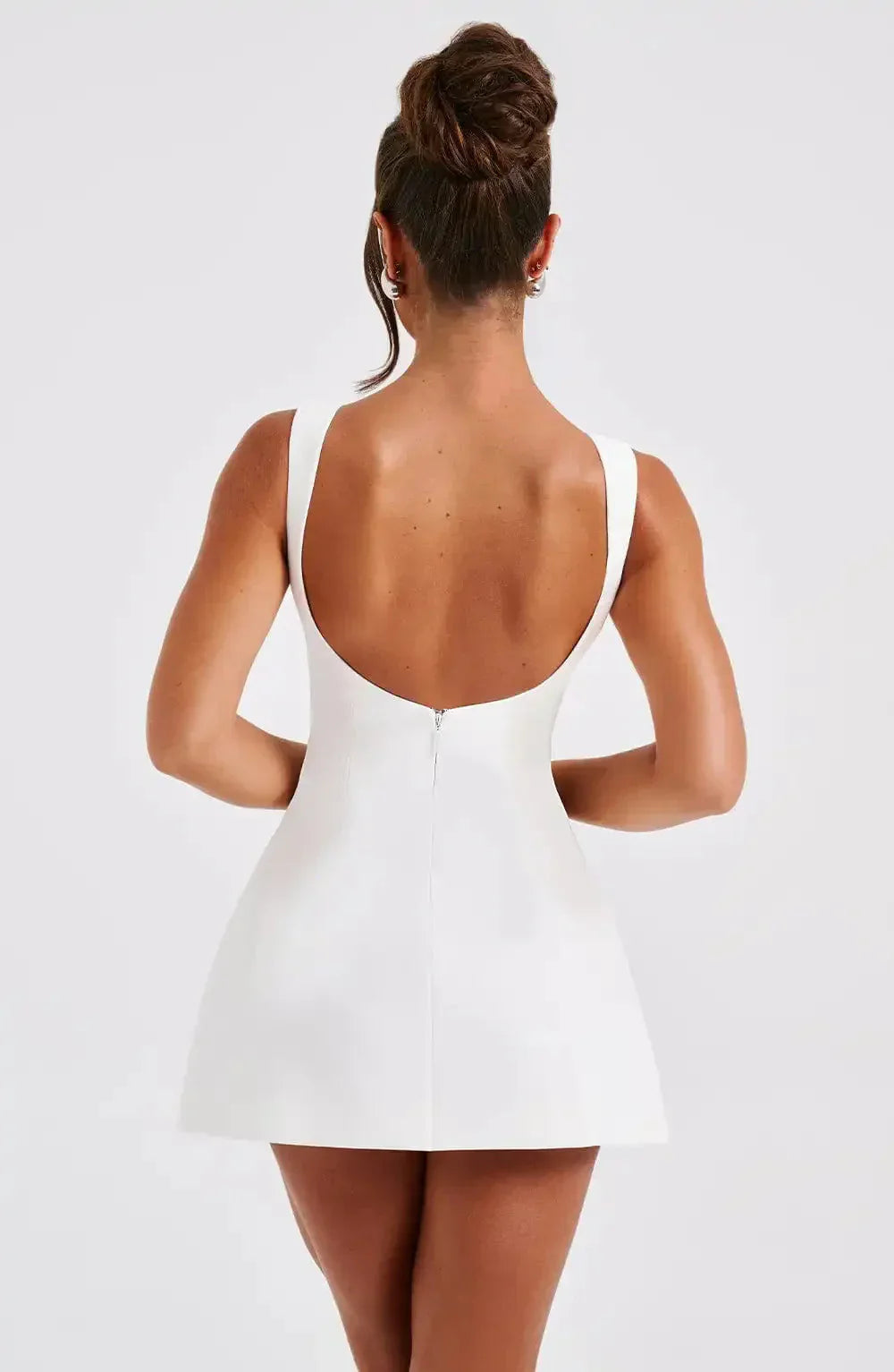 "Stylish black & white women's A-Line boat neck mini dress with elegant sleeveless design, perfect for any occasion."