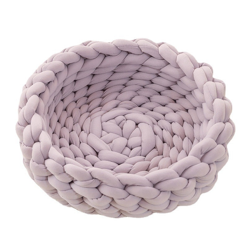 Modern hand-woven cat bed, offering a cozy retreat. Stylish pet accessory and essential feline furniture.