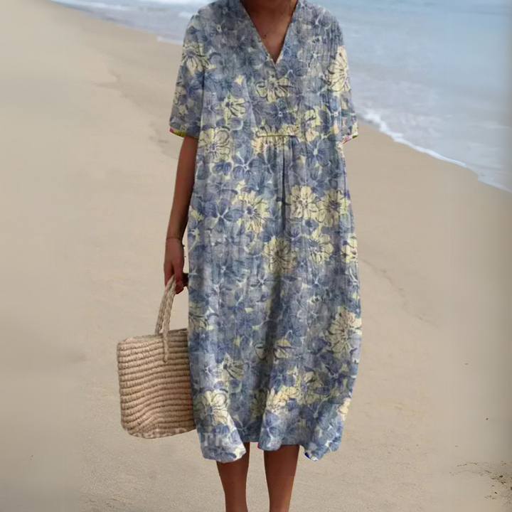 Full length view of a stylish women's multicolour V-neck floral dress, elegant and modern.