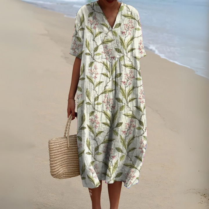 Stylish women's V-neck dress featuring a beautiful multicolour floral pattern.