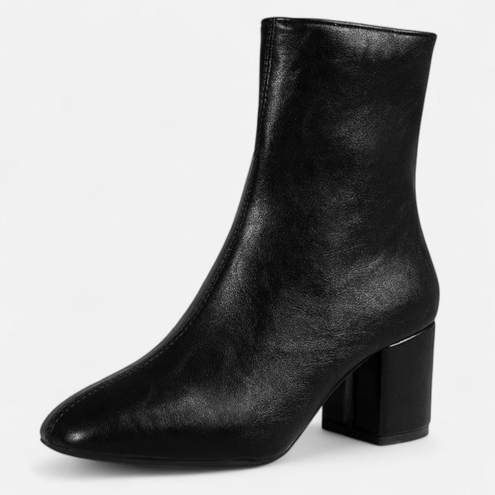 Elegant women's fashion ankle boots with a chic block heel. Versatile footwear for autumn & winter outfits.