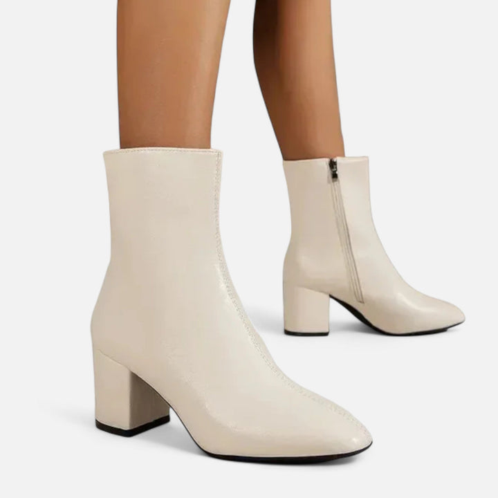 Chic women's ankle boots featuring a stable block heel, offering comfort and style for any season. Everyday wear.