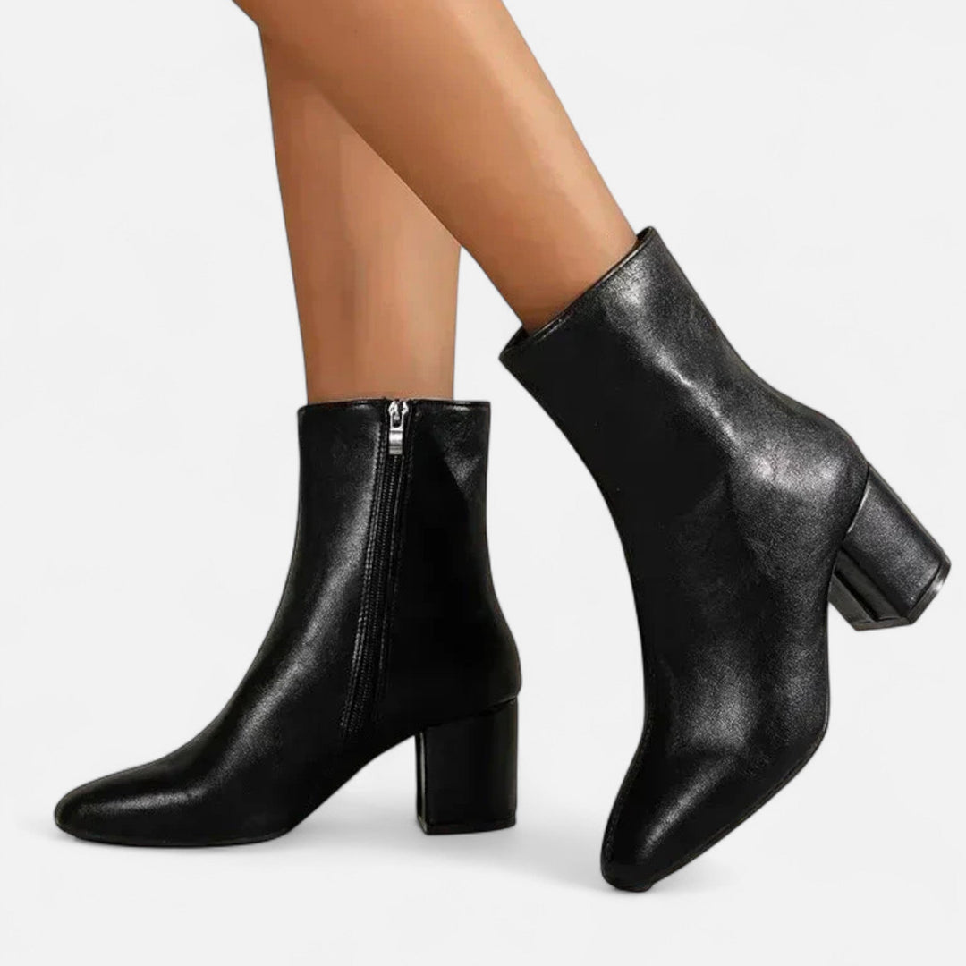 Fashionable women's ankle boots with a stable block heel. Essential elegant footwear for autumn style & comfort.