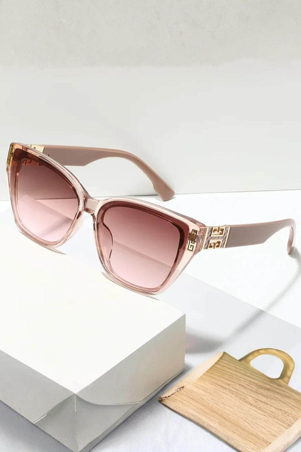 Women's cat eye sunglasses for outdoor style & UV protection, featuring chic gold detail.