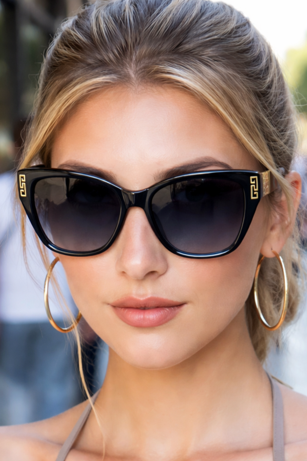 Women's cat eye sunglasses with UV protection & stylish gold accents. Essential women's eyewear.