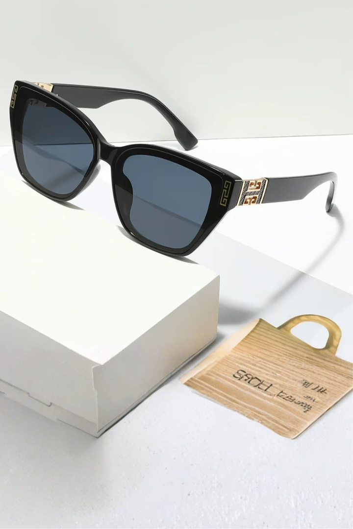 Women's cat eye sunglasses featuring exquisite gold detail on the frames. A premium fashion accessory.