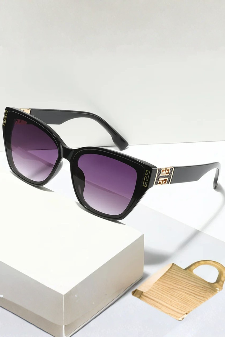 Must-have women's cat eye sunglasses, gold trim. A chic & stylish fashion accessory.